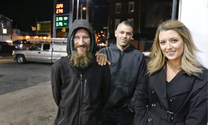 Johnny Bobbitt (L), Kate McClure (R) and McClure's boyfriend Mark D'Amico pose at a Citgo station in Philadelphia. 