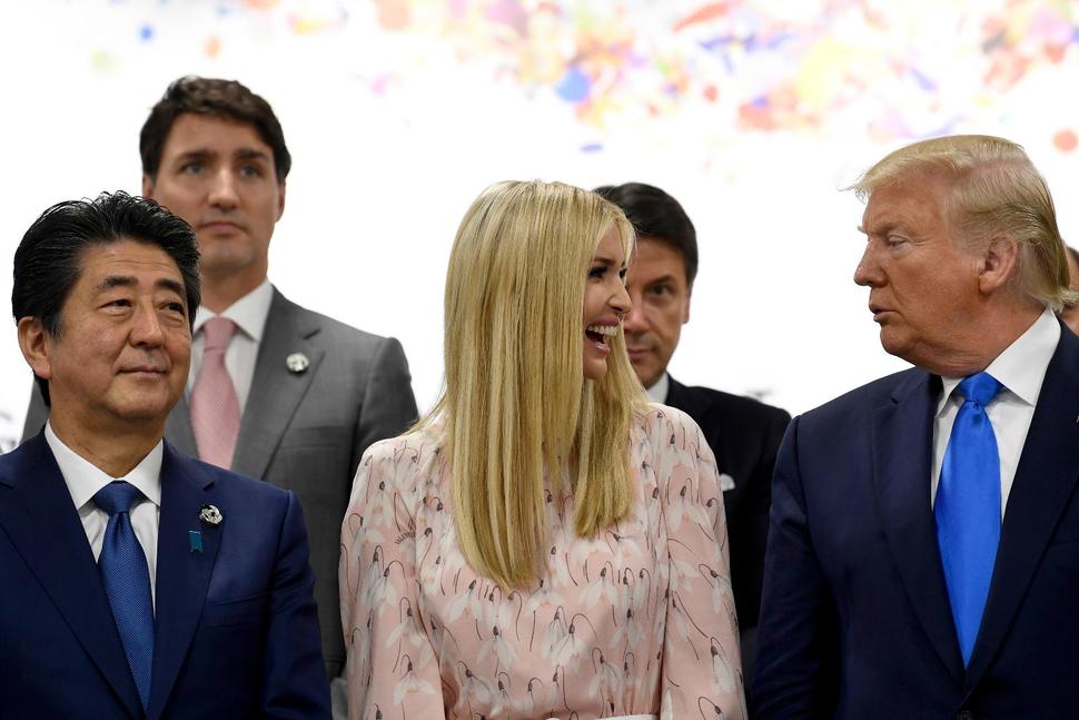 Ivanka Trump, center, talks with her father President Donald Trump, right, after speaking at the G-20 summit