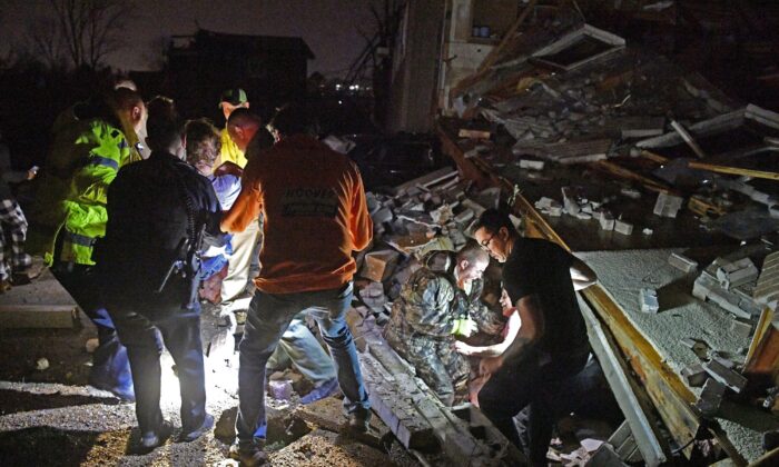 Rescue workers free Bill and Shirley Wallace from their home that collapsed, trapping them under rubble after a tornado hit area in Mt. Juliet, Tenn., on March 3 2020.
