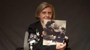 This photo provide by the World Jewish Congress, Tova Friedman, an 82-year-old Polish-born Holocaust survivor holding a photograph of herself as a child with her mother, who also survived the Nazi death camp Auschwitz, in New York, Friday, Dec.13, 2019.