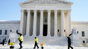 The Supreme Court shown Friday, Jan. 7, 2022, in Washington. The Supreme Court is taking up two major Biden administration efforts to bump up the nation's vaccination rate against COVID-19 at a time of spiking coronavirus cases because of the omicron variant. (AP Photo/Evan Vucci)