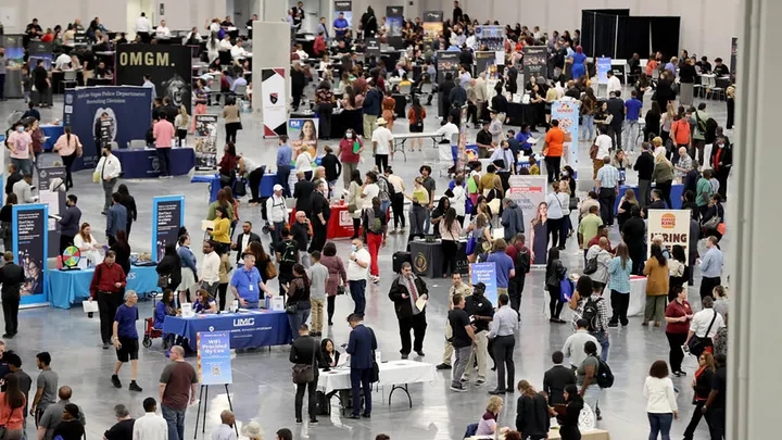 Job seekers visit booths during the Spring Job Fair at the Las Vegas Convention Center Friday, April 15, 2022.  ((K.M. Cannon/Las Vegas Review-Journal)  / Getty Images)