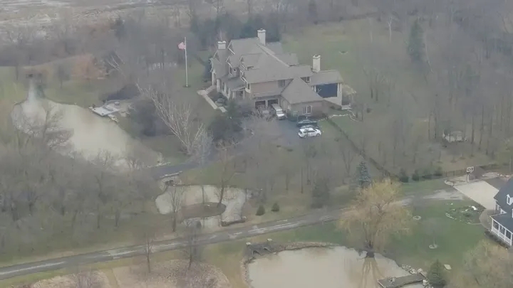 Former Vice President Mike Pence's Indiana home is seen from the air as a police vehicle is seen in the driveway on Friday. (NewsNation)